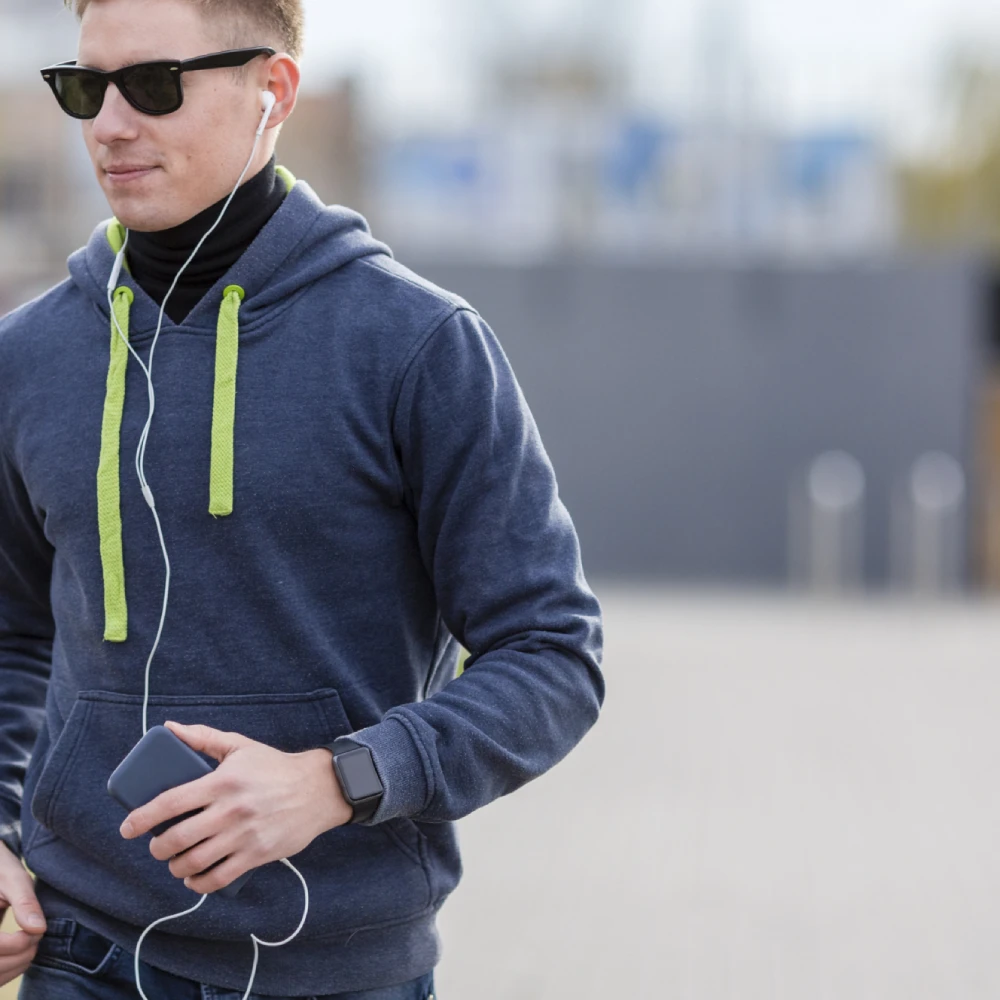 man-listening-music-earphones-while-running-with-copy-space